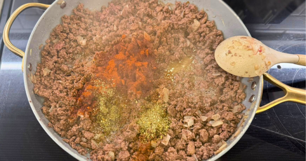 Ground deer cooked down with seasonings and onion to make the Easy One-Pot Halloween Goulash Recipe.